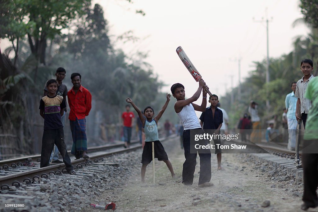 Bangladeshi Children Play Cricket On Railway Tracks In Chittagong