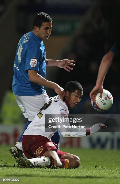 Jamie Reckord of Northampton Town attempts to play the ball under pressure from Jack Lester of Chesterfield during the npower League Two match...