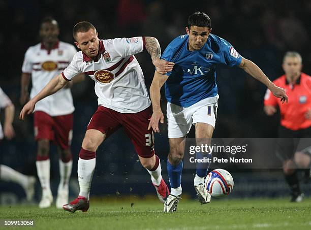 Jack Lester of Chesterfield and Josh Walker of Northampton Town challenge for the ball during the npower League Two match between Chesterfield and...