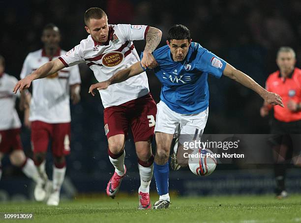 Jack Lester of Chesterfield and Josh Walker of Northampton Town challenge for the ball during the npower League Two match between Chesterfield and...