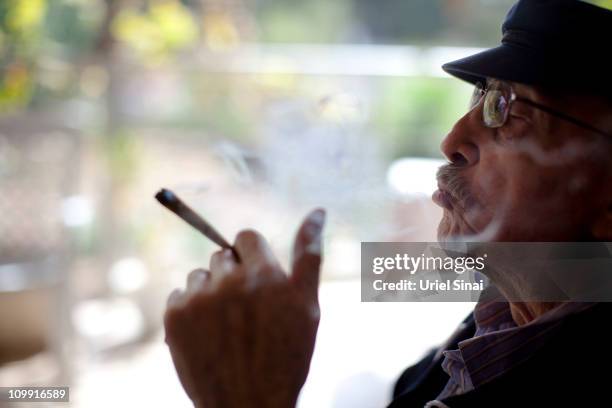 Moshe Rute smokes cannabis at the Hadarim nursing home, on March 09, 2011 in Kibutz Naan, Israel. In conjunction with Israel's Health Ministry, The...