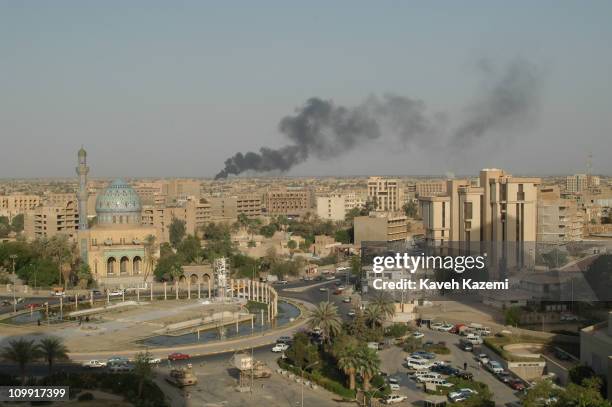 View of Baghdad skyline after the invasion of US forces in operation Shock and Awe in March 2003, Baghdad, Iraq. In the square in front of the...