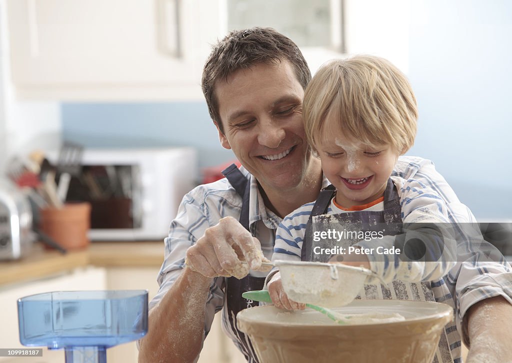 Father and son baking together