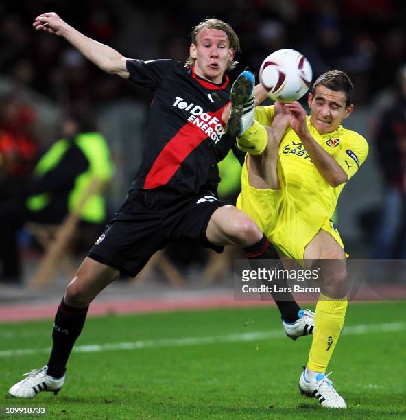 Domagoj Vida of Leverkusen challenges Marco Ruben of Villarreal during the UEFA Europa League round of 16 first leg match between Bayer Leverkusen...