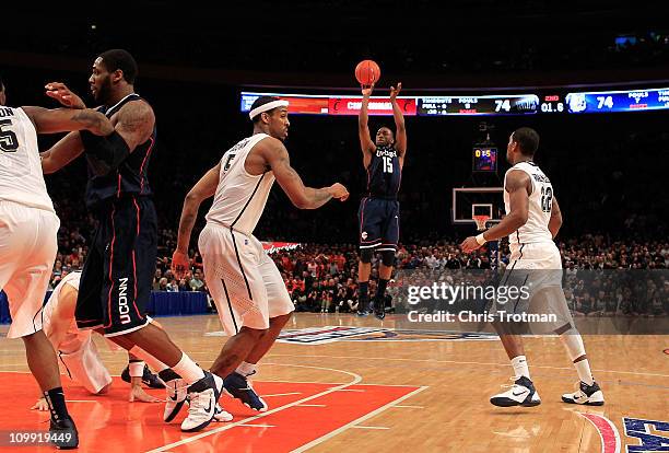 Kemba Walker of the Connecticut Huskies shoots a game winning basket against the Pittsburgh Panthers during the quarterfinals of the 2011 Big East...