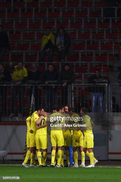 Nilmar of Villarreal celebrates his team's second goal with team mates during the UEFA Europa League round of 16 first leg match between Bayer...