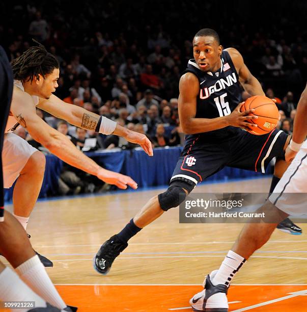 With the clock winding down, Connecticut's Kemba Walker worked the floor and got off this shot at the buzzer to break a tie with Pittsburgh and win...