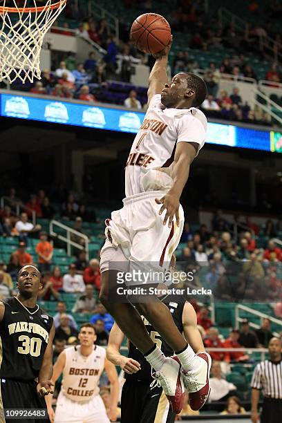 Reggie Jackson of the Boston College Eagles shoots against Travis McKie of the Wake Forest Demon Deacons during the second half of the game in the...