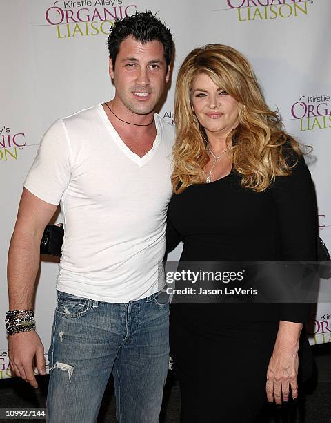 Dancer Maksim Chmerkovskiy and actress Kirstie Alley attend the Organic Liaison store grand opening on March 9, 2011 in Los Angeles, California.