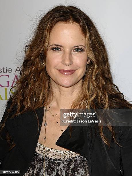 Actress Kelly Preston attends the Organic Liaison store grand opening on March 9, 2011 in Los Angeles, California.