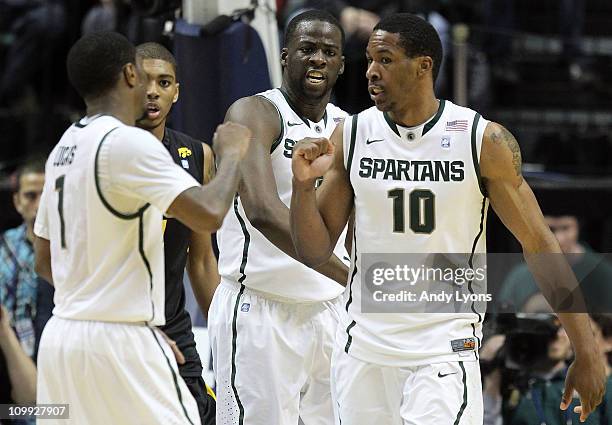 Kalin Lucas , Draymond Green and Delvon Roe of the Michigan State Spartans celebrate a play against the Iowa Hawkeyes during the first round of the...