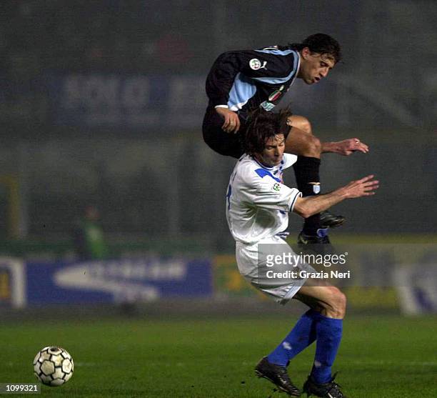 Hernan Crespo of Lazio lands on the shoulders of Filippo Galli during the Brescia v Lazio Serie A match plaued at the Mario Rigamonti Stadium,...