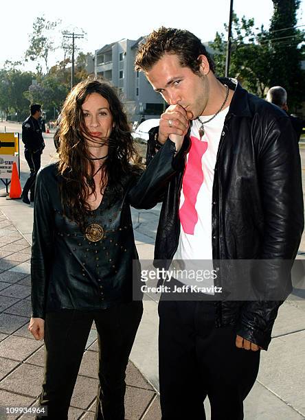 Alanis Morissette and Ryan Reynolds during 2003 MTV Movie Awards - Arrivals at The Shrine Auditorium in Los Angeles, California, United States.
