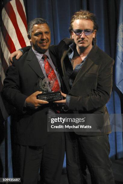 Award Winner Dr. Alex Coutinho and Bono during UNA - USA Global Leadership Award at New York Sheraton Hotel in New York City, New York, United States.
