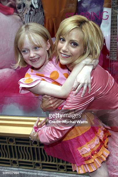 Brittany Murphy and Dakota Fanning during Brittany Murphy Unveils the Exclusive Uptown Girls Window Display at Henri Bendel at Henri Bendel in New...