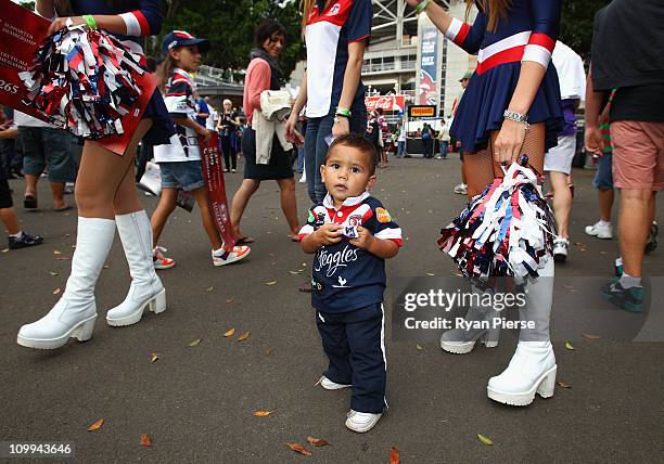 Young Roosters fan arrive at the ground before the round one NRL match between the Sydney Roosters and the South Sydney Rabbitohs at the Sydney...