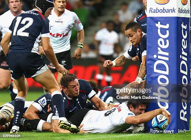 Ryan Kankowski of the Sharks puts the ball over the line for a try during the round four Super Rugby match between the Melbourne Rebels and the...