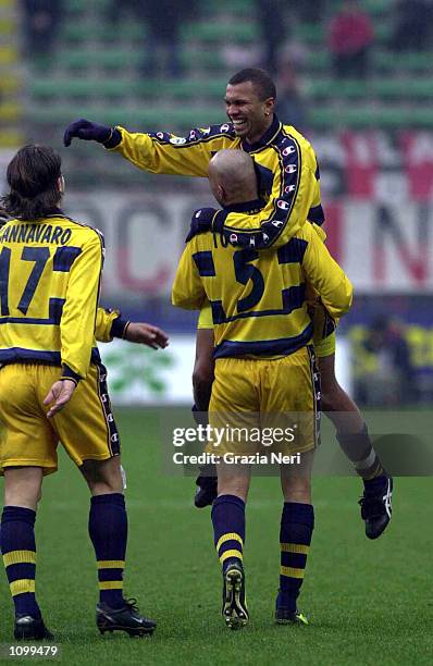 Parma players celebrate a goal during the Serie A 21st Round League match between AC Milan and Parma played at the Giuseppe Meazza San Siro Stadium,...