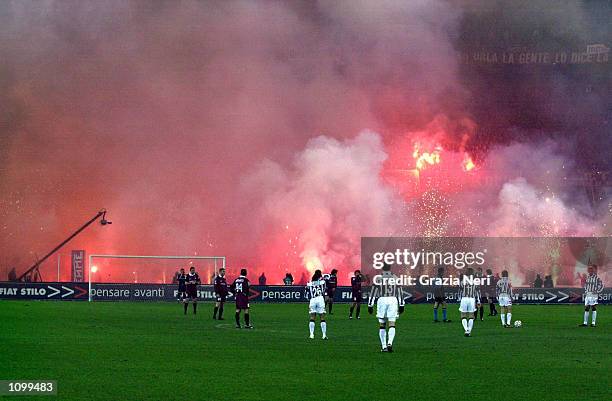 Torino fans let off flares during the Serie A match between Torino and Juventus, played at the Delle Alpi Stadium, Turin. DIGITAL IMAGE Mandatory...