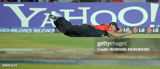 England fielder Tim Bressnan takes a catch to dismiss unseen Bangladesh batsman Abdur Razzak during the ICC Cricket World Cup 2011 match between...