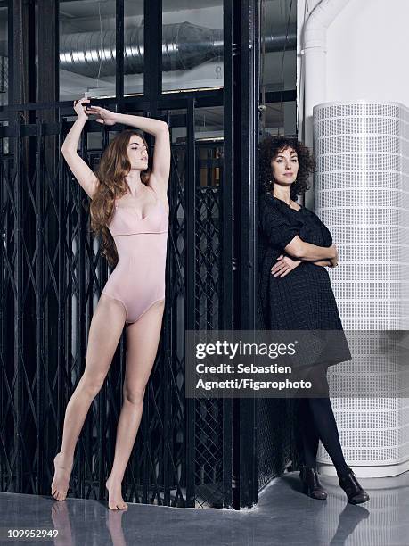 Artistic director of Eres, Valerie Desfosses poses with a model at a fashion shoot for Madame Figaro on January 12, 2011 in Paris, France. Published...