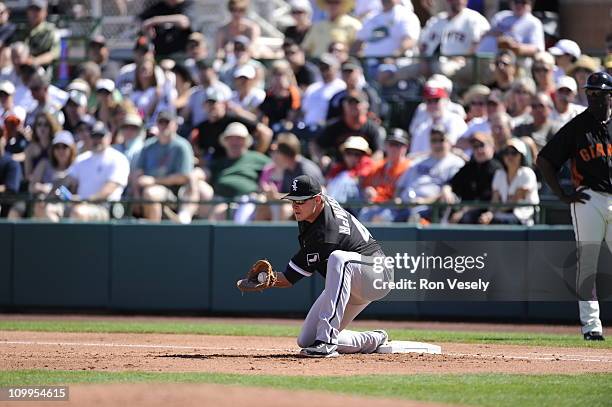 Dallas McPherson of the Chicago White Sox fields during the game against the San Francisco Giants on March 09, 2011 at Scottsdale Stadium in...