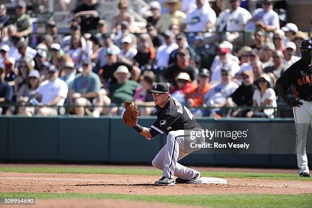 Dallas McPherson of the Chicago White Sox fields during the game against the San Francisco Giants on March 09, 2011 at Scottsdale Stadium in...