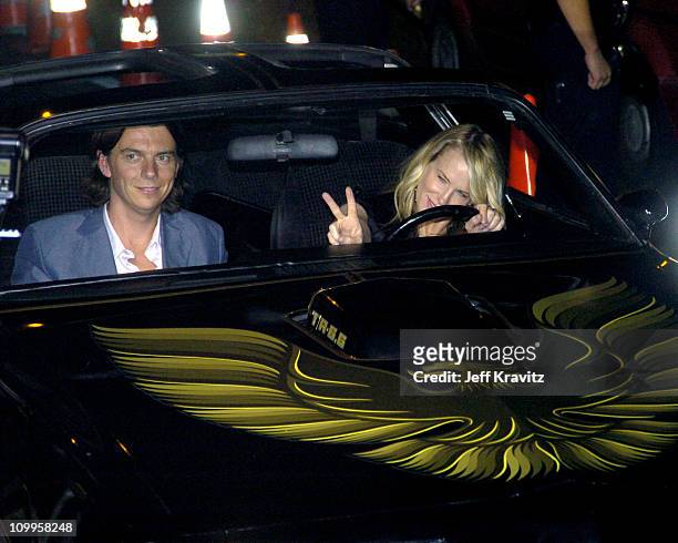 Daryl Hannah and guest during Kill Bill: Vol. 2 World Premiere - Red Carpet at Arclight Cinerama Dome in Los Angeles, California, United States.