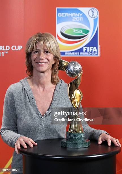 Carolina Morace , Head Coach of Canadian national women's team poses with the Women's World cup trophy during the FIFA Women's World Cup Welcome Tour...