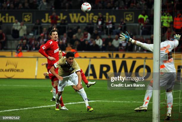 Milivoje Novakovic of Koeln scores his teams fourth goal during the Bundesliga match between 1. FC Koeln and Hannover 96 at RheinEnergieStadion on...