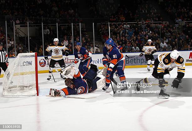 Nathan Horton of the Boston Bruins scores at 16:29 of the first period against Al Montoya of the New York Islanders at the Nassau Coliseum on March...