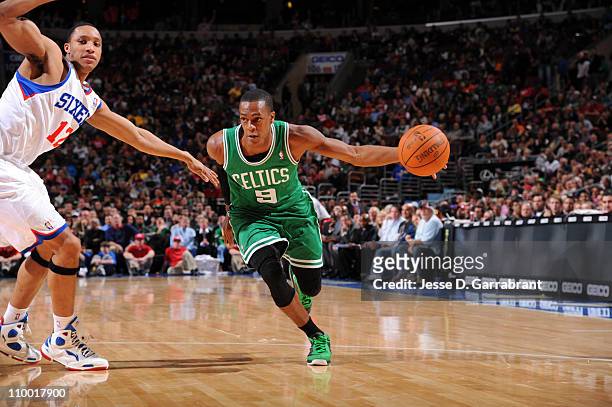Rajon Rondo of the Boston Celtics drives to the basket against Evan Turner of the Philadelphia 76ers on March 11, 2011 at the Wells Fargo Center in...