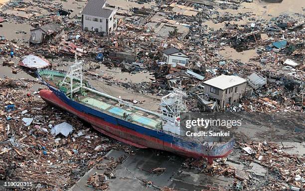 Ship is washed onto the city center of Kesennuma on March 12, 2011 in Kesennuma, Miyagi, Japan. An earthquake measuring 8.9 on the Richter scale has...