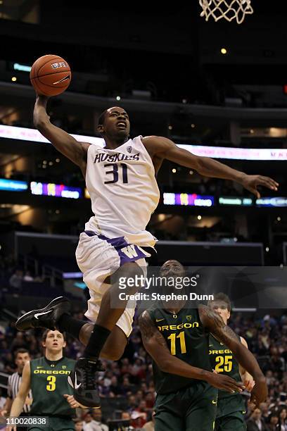 Terrence Ross of the Washington Huskies goes up for a dunk late in the second half while taking on the Oregon Ducks in the semifinals of the 2011...