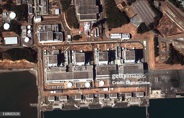 In this satellite view, Fukushima Dai-Ichi Nuclear Power plant is damaged by an earthquake which caused a tsunami, March 12, 2011 in Okuma, Japan. An...