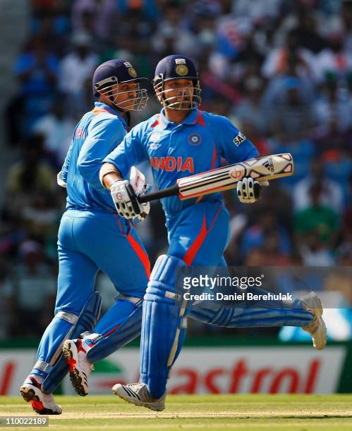 Virender Sehwag and Sachin Tendulkar of India run between wickets during the Group B ICC World Cup Cricket match between India and South Africa at...