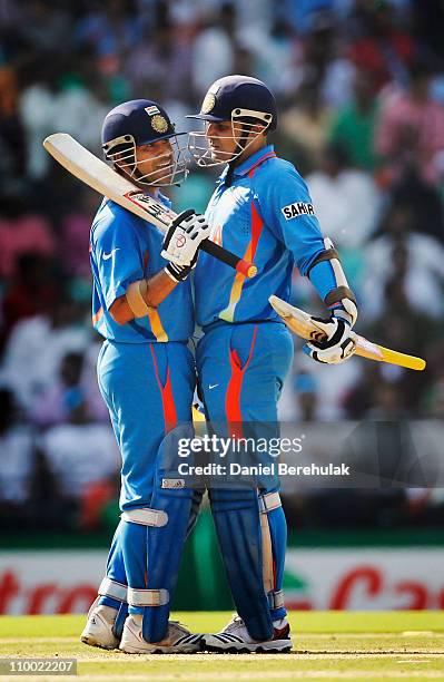 Virender Sehwag and Sachin Tendulkar of India talk amongst themselves during the Group B ICC World Cup Cricket match between India and South Africa...