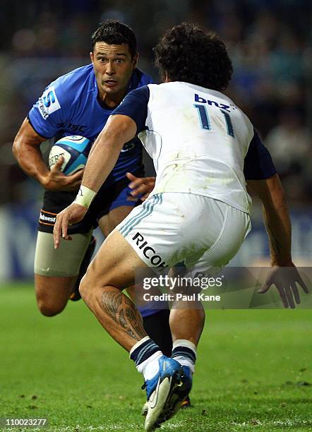 Cameron Shepherd of the Force looks to evade Rene Ranger of the Blues during the round four Super Rugby match between the Western Force and the Blues...