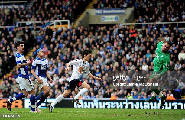Chung-Yong Lee of Bolton Wanderers scores their third and the winning goal past Ben Foster of Birmingham City during the FA Cup sponsored by E.On...