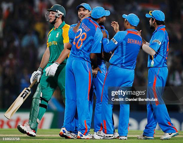 Zaheer Khan of India celebrates with teammates Yusuf Pathan and Yuvraj Singh after taking the wicket of Graeme Smith of South Africa during the Group...