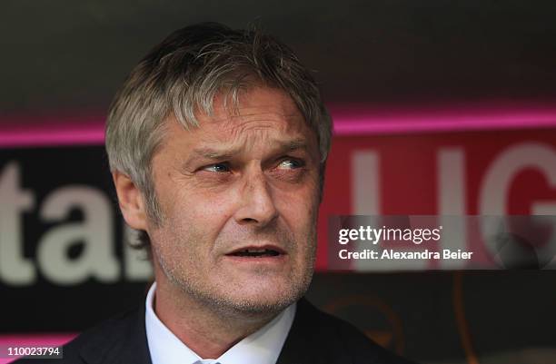 Team coach Armin Veh of Hamburg awaits the start of the Bundesliga match between 1. FC Muenchen and Hamburger SV at Allianz Arena on March 12, 2011...