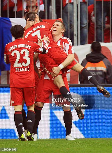 Franck Ribery of Bayern Muenchen celebrates his second goal with his teammates Danijel Pranjic and Bastian Schweinsteiger during the Bundesliga match...