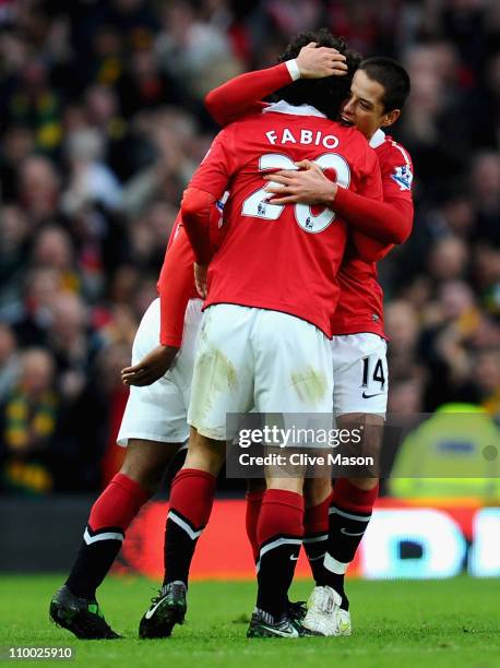 Fabio Da Silva of Manchester United celebrates scoring the opening goal with teammate Javier Hernandez during the FA Cup sponsored by E.On Sixth...