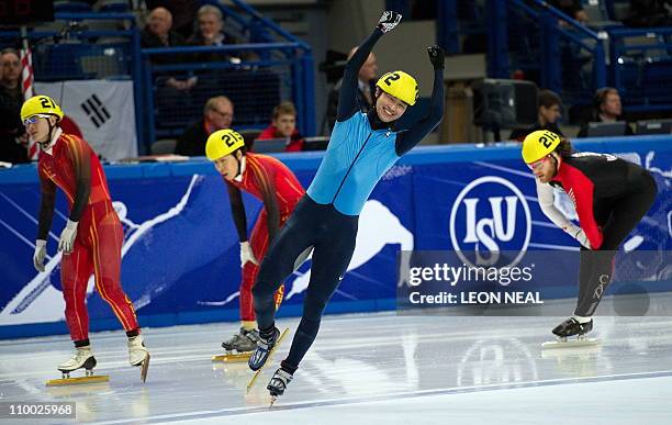 Simon Cho of the USA celebrates after beating Liang Wenhao of China , Liu Xianwei of China and Olivier Jean of Canada in the final of the men's 500m...