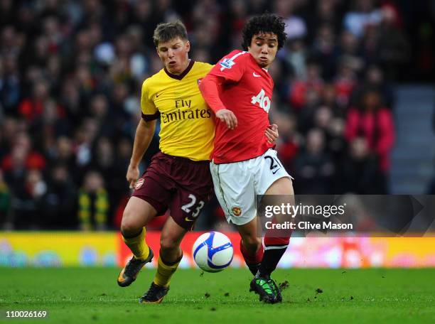 Andrey Arshavin of Arsenal and Fabio Da Silva of Manchester United battle for the ball during the FA Cup sponsored by E.On Sixth Round match between...