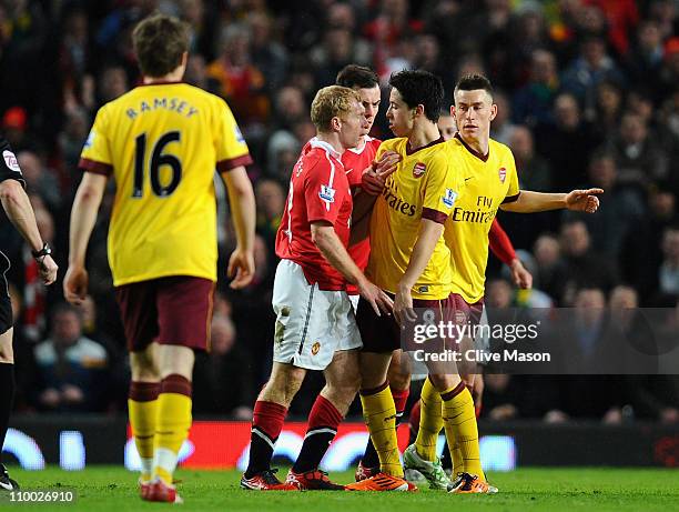 Paul Scholes of Manchester United and Samir Nasri of Arsenal argue during the FA Cup sponsored by E.On Sixth Round match between Manchester United...