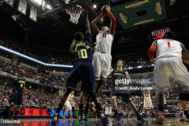 Jared Sullinger of the Ohio State Buckeyes attempts a shot in the first half against Tim Hardaway Jr. #10 of the Michigan Wolverines during the...