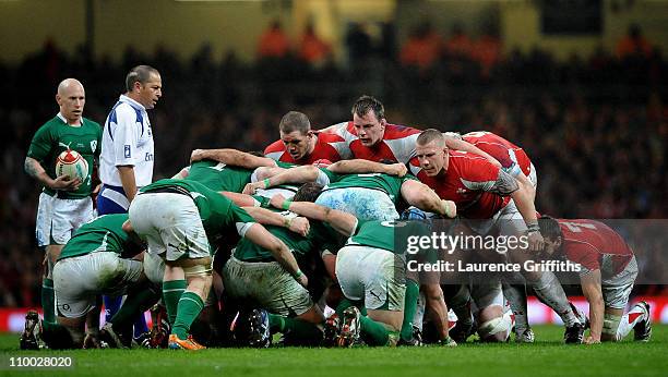 The Wales front row of Paul James, Matthew Rees and John Yapp prepare to scrummage during the RBS Six Nations Championship match between Wales and...