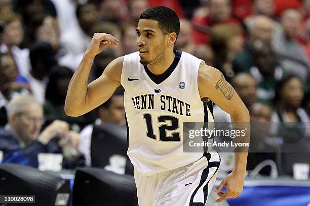 Talor Battle of the Penn State Nittany Lions reacts after he made a 3-point basket in the first half against the Michigan State Spartans during the...