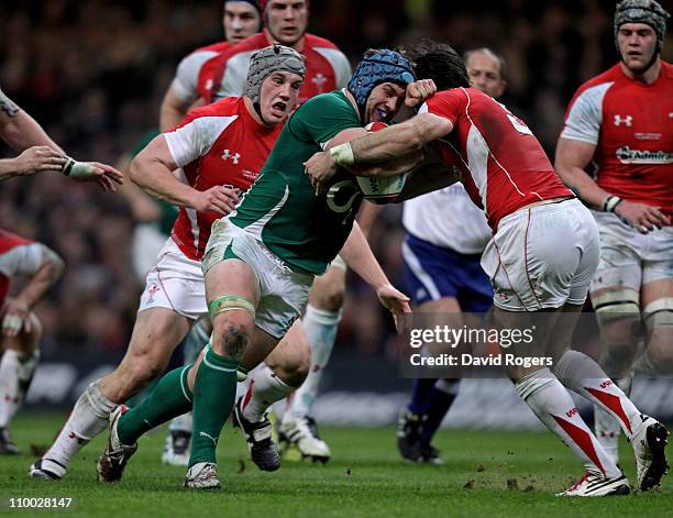 Sean OBrien of Ireland is stopped by Mike Phillips of Wales during the RBS Six Nations Championship match between Wales and Ireland at the...